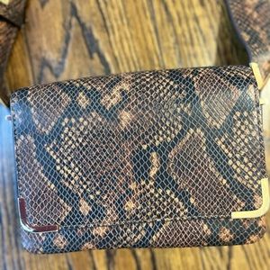 Black and brown animal print small sized crossbody purse.